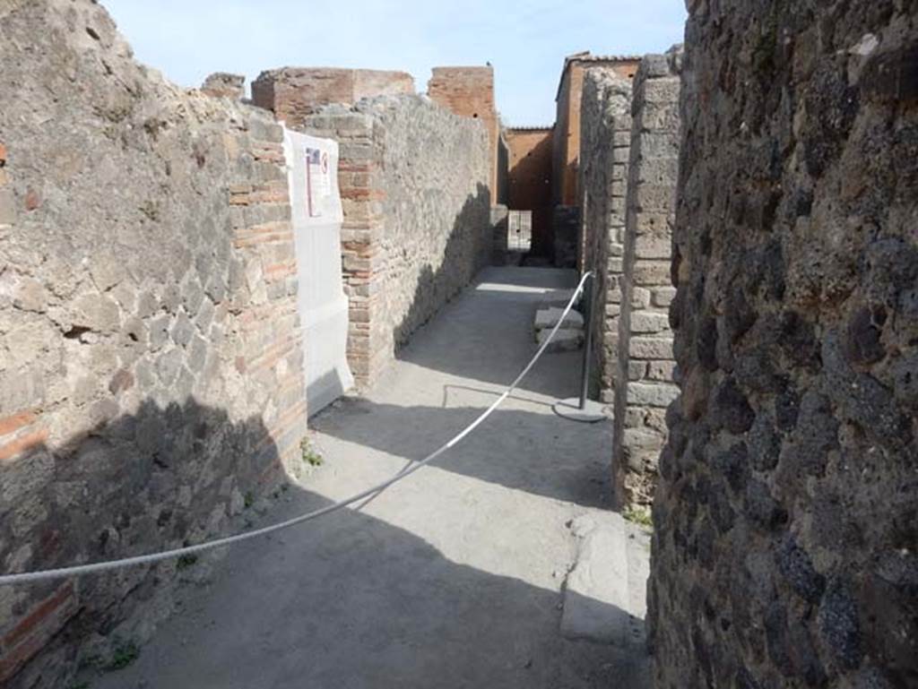 VIII.2.7 Pompeii. May 2017. Looking north along rear passageway leading to VIII.2.7. 
The doorways from VIII.2.14 and 13 are on the right. Photo courtesy of Buzz Ferebee.