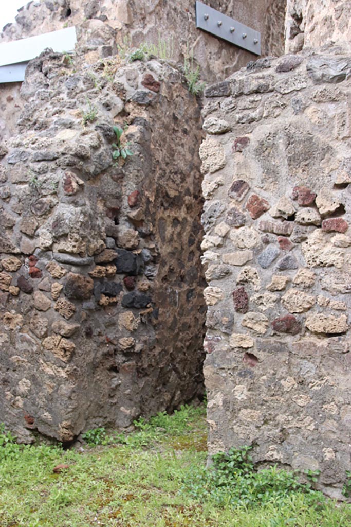 VIII.2.12 Pompeii. May 2024. 
West wall with doorway to rear of VIII.2.13. Photo courtesy of Klaus Heese.