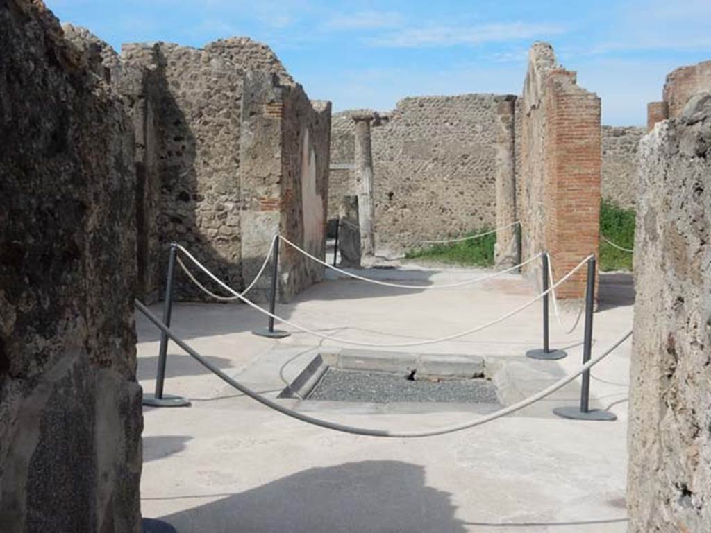 VIII.2.13 Pompeii. May 2017. Looking west across atrium towards tablinum and south end of garden area with columns, from entrance corridor. Photo courtesy of Buzz Ferebee.