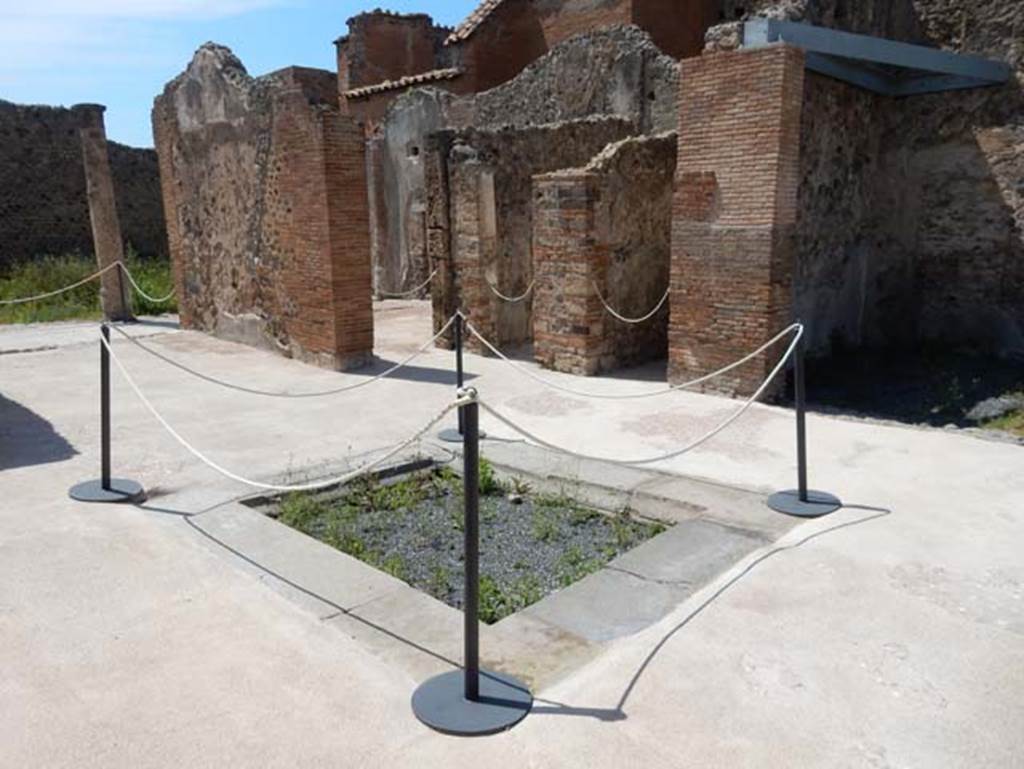 VIII.2.13 Pompeii. May 2018. Looking north-west across atrium, with tablinum, on left. 
On the west side next to the tablinum is a doorway to the triclinium overlooking the garden at its north end. Next to the triclinium doorway, are the doorways to rooms on the north side of atrium. Photo courtesy of Buzz Ferebee.