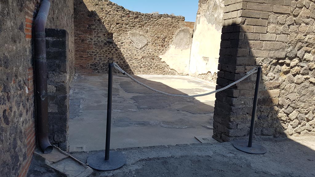 VIII.2.14 Pompeii. August 2023. 
Looking west through doorway to room in south-west corner of atrium. Photo courtesy of Maribel Velasco.