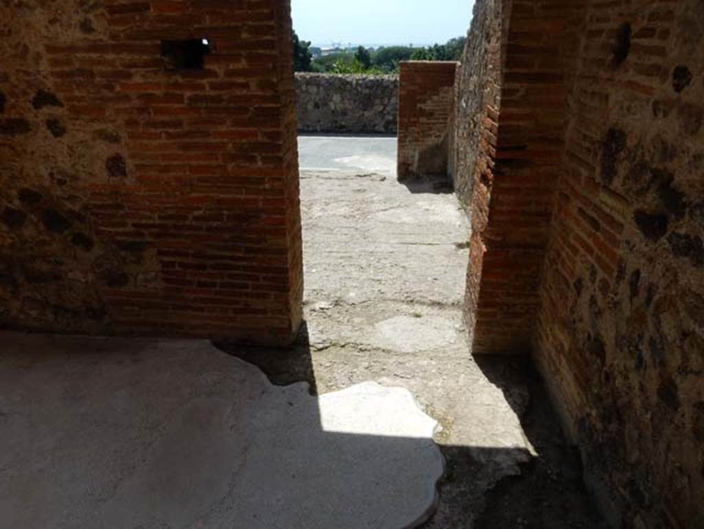 VIII.2.16 Pompeii. May 2018. Looking west across passageway and through another doorway to a room overlooking the east portico.  Photo courtesy of Buzz Ferebee.