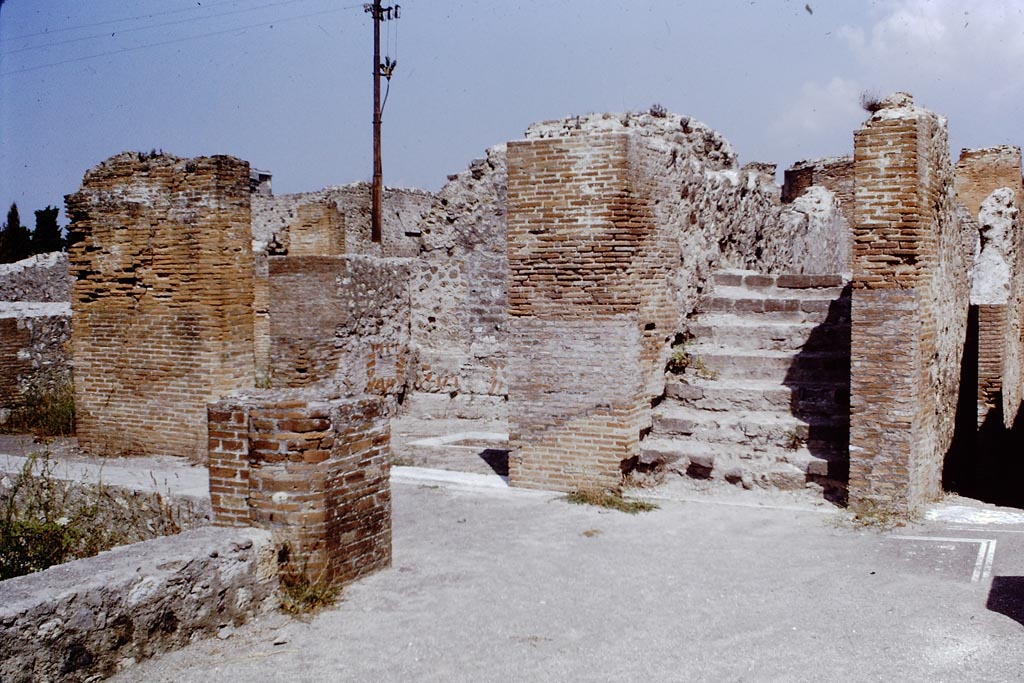 VIII.2.16 Pompeii. 1968.
Looking north towards triclinium, originally with a floor of cocciopesto in the centre of which was a shallow basin/tub with a border of moulded marble.
Found at the base of this was the emblema with the fishes, now in Naples Museum. Photo by Stanley A. Jashemski.
Source: The Wilhelmina and Stanley A. Jashemski archive in the University of Maryland Library, Special Collections (See collection page) and made available under the Creative Commons Attribution-Non-Commercial License v.4. See Licence and use details.
J68f1230