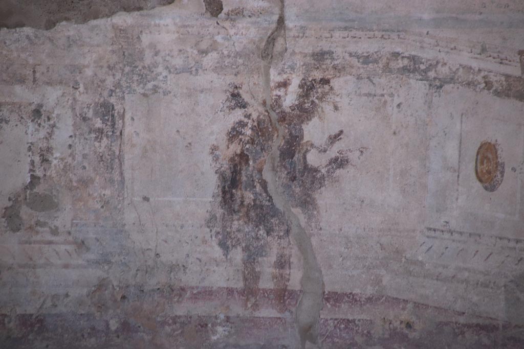 VIII.2.23 Pompeii. October 2022. 
Detail of painted figure from the zoccolo/dado towards the west end of the south wall. Photo courtesy of Klaus Heese.