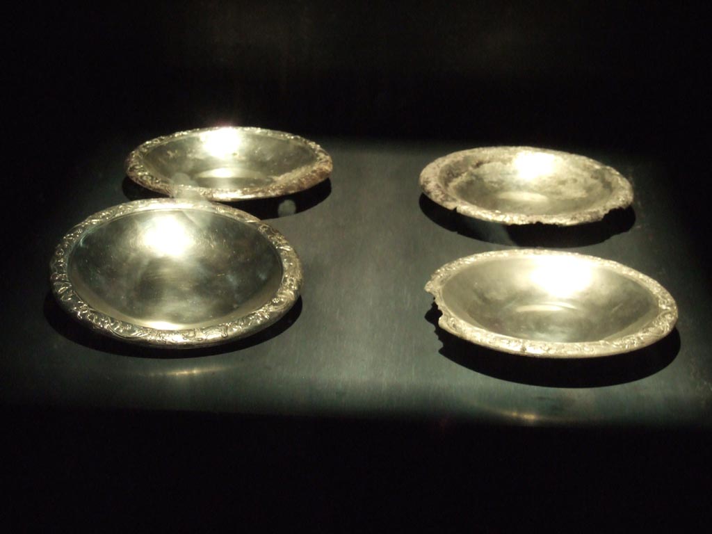 Four silver plates found 20th September 1887 in VIII.2.23. 
Now in Naples Archaeological Museum.  Inventory numbers 116345, 116346, 116347 and 116348. 
See Guzzo, P. (A cura di), 2006. Argenti a Pompei. Milano, Electa. (pp. 130-4).