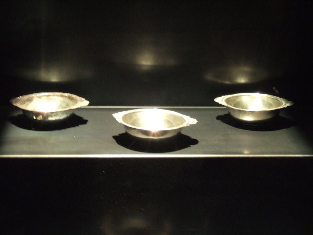 Silver plates, three of four found 20th September 1887 in VIII.2.23. 
Now in Naples Archaeological Museum.  Inventory numbers 116337, 116338 and 116340.
See Guzzo, P. (A cura di), 2006. Argenti a Pompei. Milano, Electa. (p. 133).