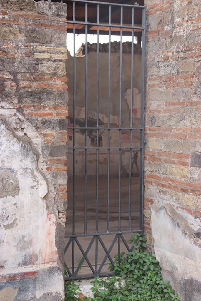 VIII.2.24 Pompeii. October 2023. 
Doorway into Palestra in south-west corner of bar-room. Photo courtesy of Klaus Heese.