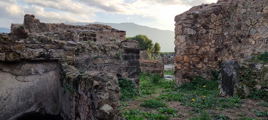 VIII.2.27 Pompeii. December 2023. 
Looking south across kitchen area towards doorway leading towards atrium. Photo courtesy of Miriam Colomer.