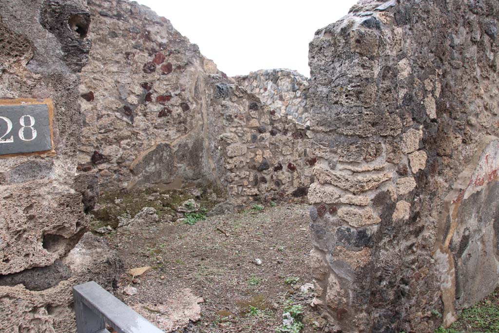 VIII.2.28 Pompeii. October 2020. Looking through doorway on left (east) side of entrance corridor, leading to the anteroom of the kitchen.
Photo courtesy of Klaus Heese.