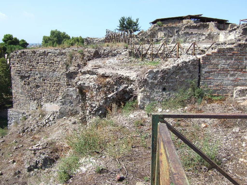 VIII.2.28/29 Pompeii. September 2005. Rear view of the two houses, from VIII.2.30. 
According to Jashemski, on the lower level at the rear of VIII.2.29, two flights of stairs led down to a terrace.