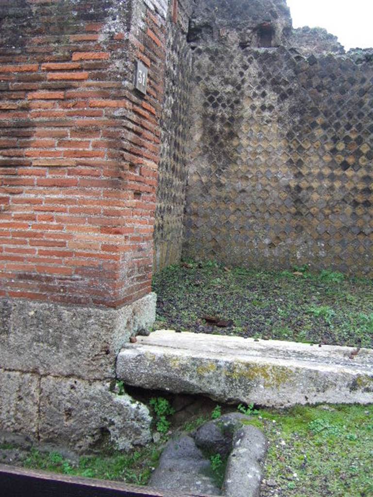 VIII.2.31 Pompeii. December 2006. East side of doorway threshold and steps outside.