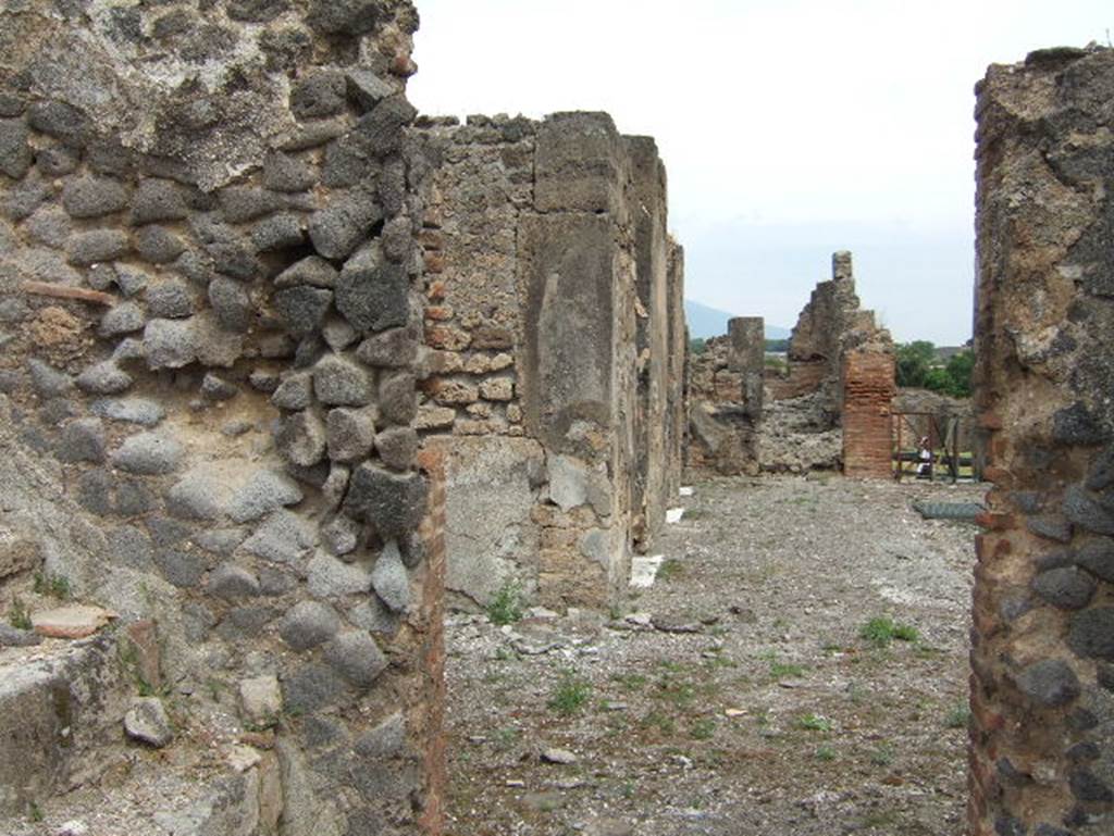 VIII.2.34 Pompeii. May 2006. Looking north from room with stairs, along west side of atrium.