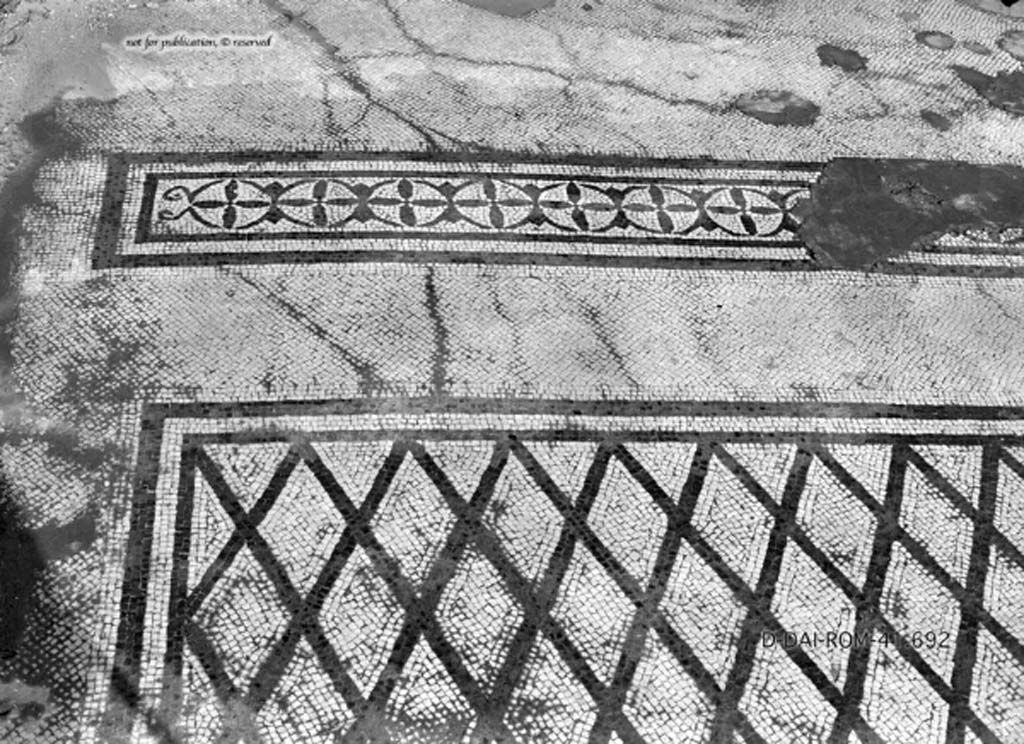 VIII.2.34 Pompeii. c.1930. Room ‘11’ on lower floor, described by Pernice and PPM as a cubiculum.
According to Blake - originally this room would have had an elegant flooring of mosaic with a net of lozenges delineated in black on a white background.
There was a narrow strip with a double row of black corolla with four petals and buds combined in a manner to form circles, typically III style.
DAIR 41.692. Photo © Deutsches Archäologisches Institut, Abteilung Rom, Arkiv.
See Pernice, E.  1938. Pavimente und Figürliche Mosaiken: Die Hellenistische Kunst in Pompeji, Band VI. Berlin: de Gruyter, (tav. 32.3, above.)