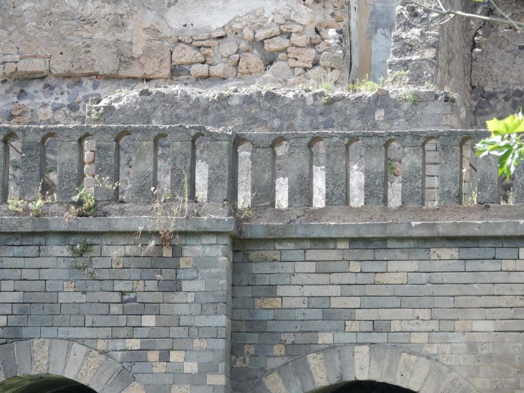 VIII.2.34 Pompeii. June 2019. 
Looking north from rear towards terrace with low parapet wall, which originally would have been covered with white plaster and formed as small arches.
Photo courtesy of Buzz Ferebee.
