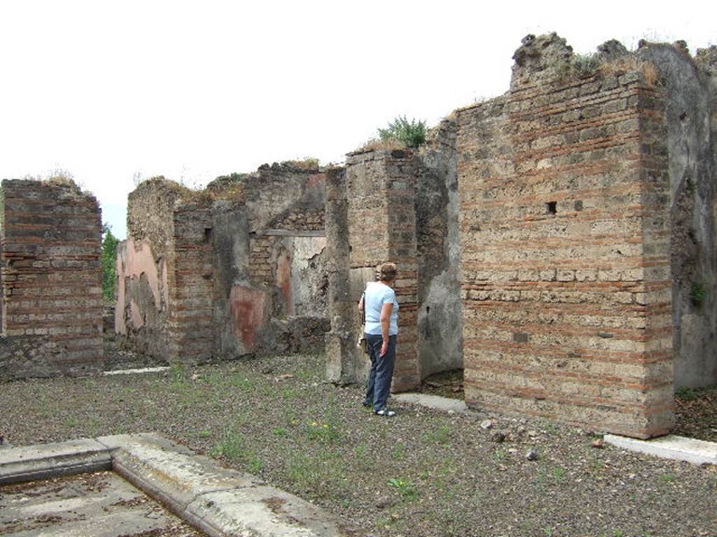 VIII.2.39 Pompeii. May 2006. West side of atrium, looking south. 
Doorways to room q, andron/corridor, room h, ala, and rooms k and l, on west side of atrium.