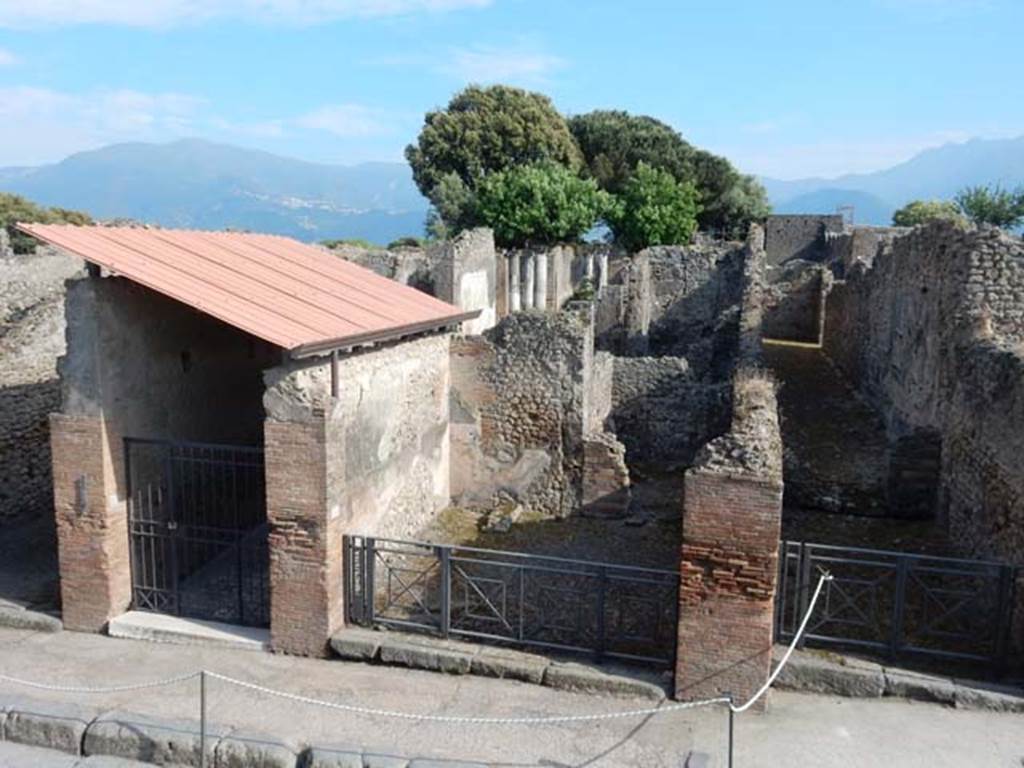 VIII.3.8 Pompeii, on left. May 2015. Looking south across Via dell’Abbondanza towards entrance doorway. Photo courtesy of Buzz Ferebee.