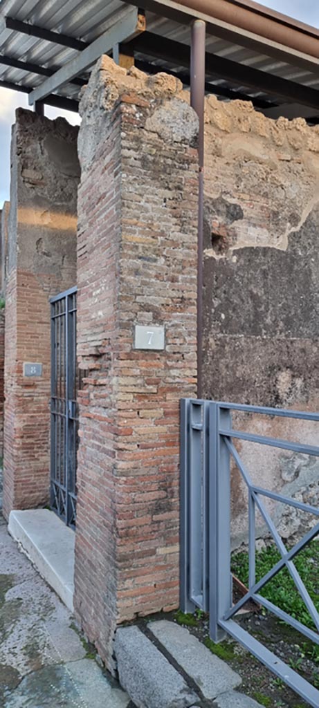 VIII.3.8/7 Pompeii. December 2023. 
Pilaster on west (right) side of entrance doorway to VIII.3.8.
Photo courtesy of Miriam Colomer.