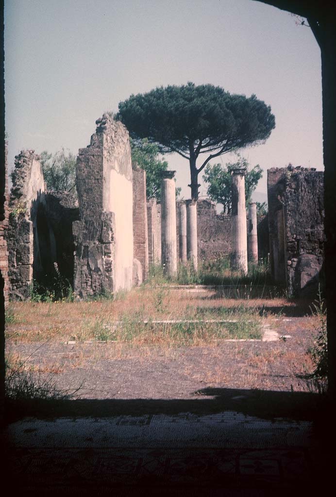 VIII.3.8 Pompeii. August 1965. 
Looking south from end of mosaic in fauces, across atrium to peristyle. Photo courtesy of Rick Bauer.