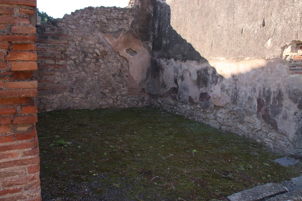 VIII.3.9 Pompeii. October 2022. Looking south-west across shop-room. Photo courtesy of Klaus Heese. 
On the south wall the outline of the stairs to the upper floor can still be recognised.
On the west wall a high zoccolo of cocciopesto can be seen.