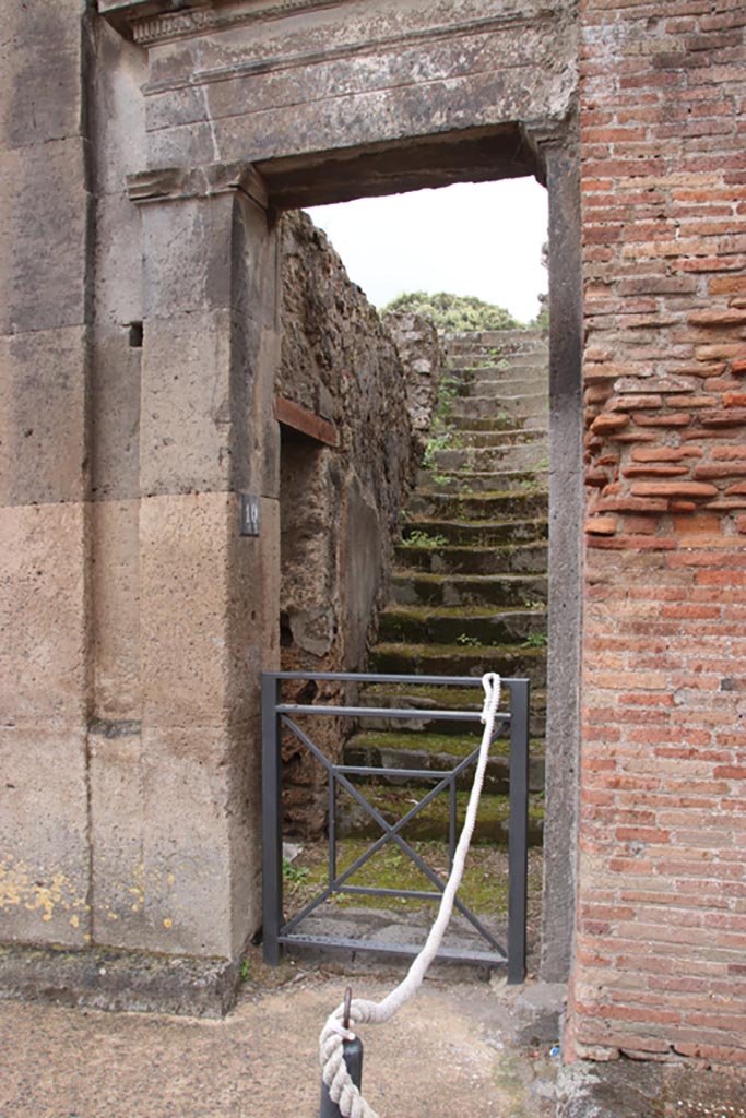 VIII.3.10 Pompeii. May 2024. 
Steps to upper floor, and doorway in east wall into VIII.3.11. Photo courtesy of Klaus Heese.