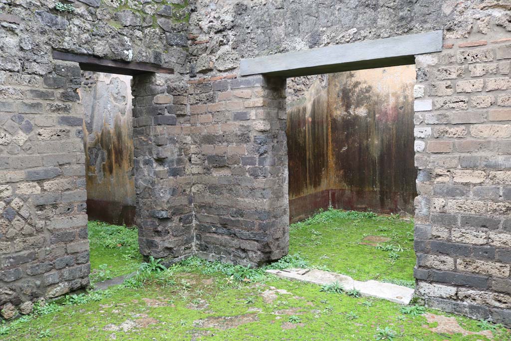 VIII.3.12, Pompeii., December 2018. 
Looking towards south-west corner of yard/courtyard, with doorway to cubiculum, on left, and into oecus, on right.
Photo courtesy of Aude Durand.