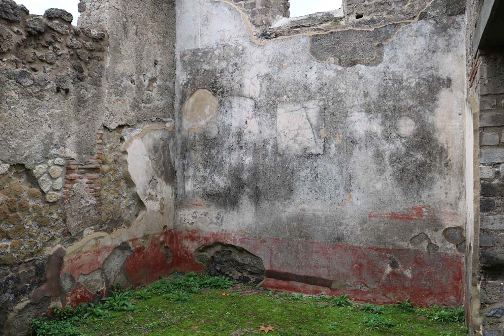 VIII.3.12 Pompeii., December 2018. 
Looking towards north-east corner and east wall of triclinium, with remains of central painting and medallion. Photo courtesy of Aude Durand.