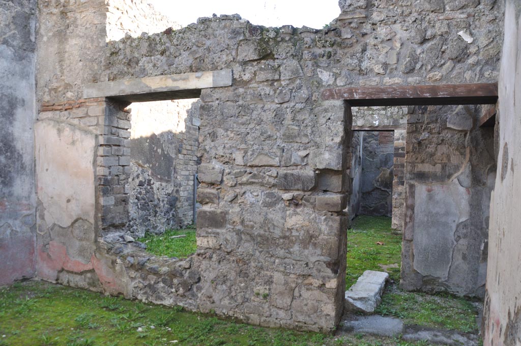VIII.3.12 Pompeii. January 2024. 
Looking south-east along south wall of triclinium with window and doorway through to atrium/yard. Photo courtesy of Domenico Esposito.