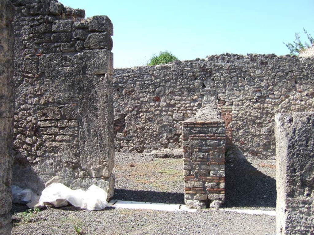 VIII.3.14 Pompeii. September 2005. Looking west from atrium to doorway to triclinium, on left. In the corner of the triclinium, the remains of the ancient stairs to upper floor can be seen. According to Fiorelli, they would have been in communication with the upper floor of the house next-door.
See Pappalardo, U., 2001. La Descrizione di Pompei per Giuseppe Fiorelli (1875). Napoli: Massa Editore. (p.124)