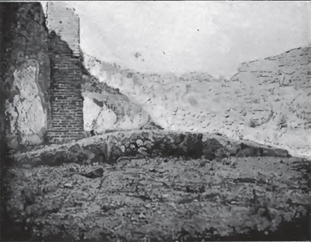 VIII.3.15 Pompeii. About 1906. Garden east side. Curved stibadium or sigma, a semi-circular dining couch.
According to Jashemski –
This unusual building, according to Fiorelli, although originally part of the house at VIII.3.14, had been converted into a caupona.
The garden, which made up a large part of the building, had a portico on the west and south, supported on the south by two square pillars, which were painted with vines. A low wall, which had an entrance on the west, enclosed the garden on the west and south.
In the east part of the garden was a masonry stibadium (3.50m in its widest dimension), the only one found thus far at Pompeii.
It was perhaps shaded by a pergola. The table was supported by a monopodium.
Jashemski sources –
Mazois,2;60 and pl.12,1 (plan);
Niccolini, Case, vol.2, “Descr.Gen”, p.66;
Breton, p.497-8 and drawing of stibadium on p. 498;
Dyer, p.316;
Fiorelli, “Descr”, p. 326-7;
Thedenat, p.90, and fig.46, on p.90;
Soprano, p.306-7, no. 28, and fig.28 on p.291.
See Jashemski, W. F., 1993. The Gardens of Pompeii, Volume II: Appendices. New York: Caratzas. (p.211).
According to Soprano –
Ubicazione: giardino. Diametro massimo, m.3.40.
Bibliog. Bonucci, op. c, p. 159; Breton, op. c, p. 337; Mazois II, p.50, tav.xii, fig. 1 e 2;
Thedenat, op. c. p. 84, and fig.50;
Fiorelli, op. c, p. 237;
Dyer, op. c, p. 315.
Era l’unica stibadium rinvenuto, finora, a Pompei. 
Si trova nella parte orientale di una piccola area di giardino circondata da podio lungo i lati di nord e di ovest, ed era completamente privo di intonaco. 
Delle due semicirconferenze che delimitano questo stibadium, quella interna era regolare; quella esterna era grossolanamente ricurva.
La mensa, con monopodio, di cui fa cenno il Dyer, non e piu in situ.
See Soprano, P. (1950). I triclini all’aperto di Pompei. (In Pompeiana, raccolta di studi per il secondo centenario degli scavi di Pompei. Napoli, Gaetano Macchiaroli, Editore, P. 306-7, no.28).