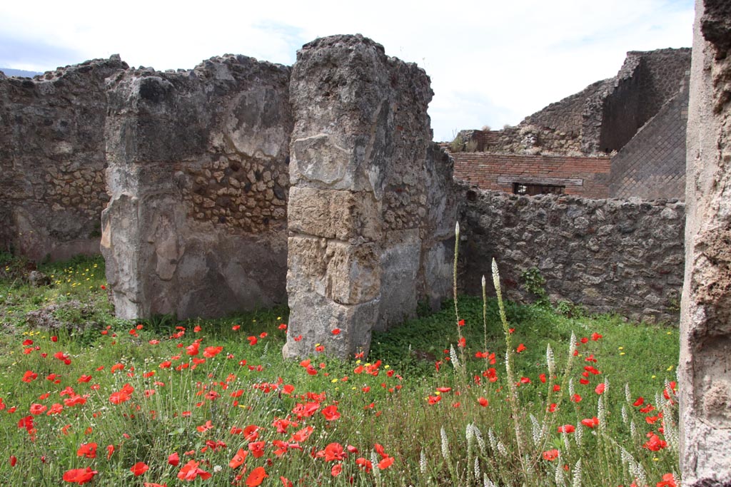 VIII.3.18 Pompeii. May 2024. West side of atrium, with a cubiculum on both sides of entrance corridor.
Looking south-west across atrium towards cubiculum on north side of entrance doorway, on right. Photo courtesy of Klaus Heese.