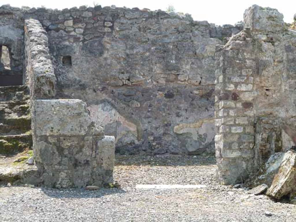 VIII.3.18 Pompeii. May 2010. Looking south to doorway to triclinium in south-west corner of atrium.Taken from VIII.3.19.