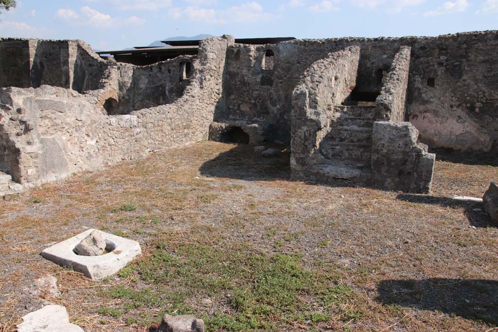 VIII.3.18 Pompeii. September 2021. 
Looking towards south-east corner of atrium (or right ala) with kitchen area, (together with kitchen area of peristyle in VIII.3.16, on left of it).
Photo courtesy of Klaus Heese.