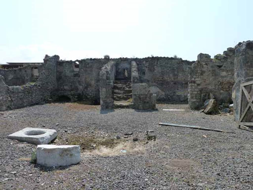 VIII.3.18 Pompeii. May 2010. 
Looking south across atrium towards kitchen, steps to upper floor and triclinium in south-west corner. Photo taken from VIII.3.19.
