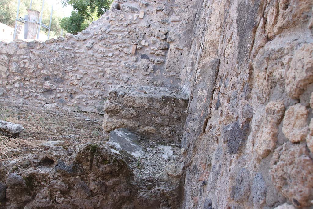 VIII.3.18 Pompeii. September 2021. 
Looking towards east wall in south-east corner of kitchen, and east side of hearth. Photo courtesy of Klaus Heese.
