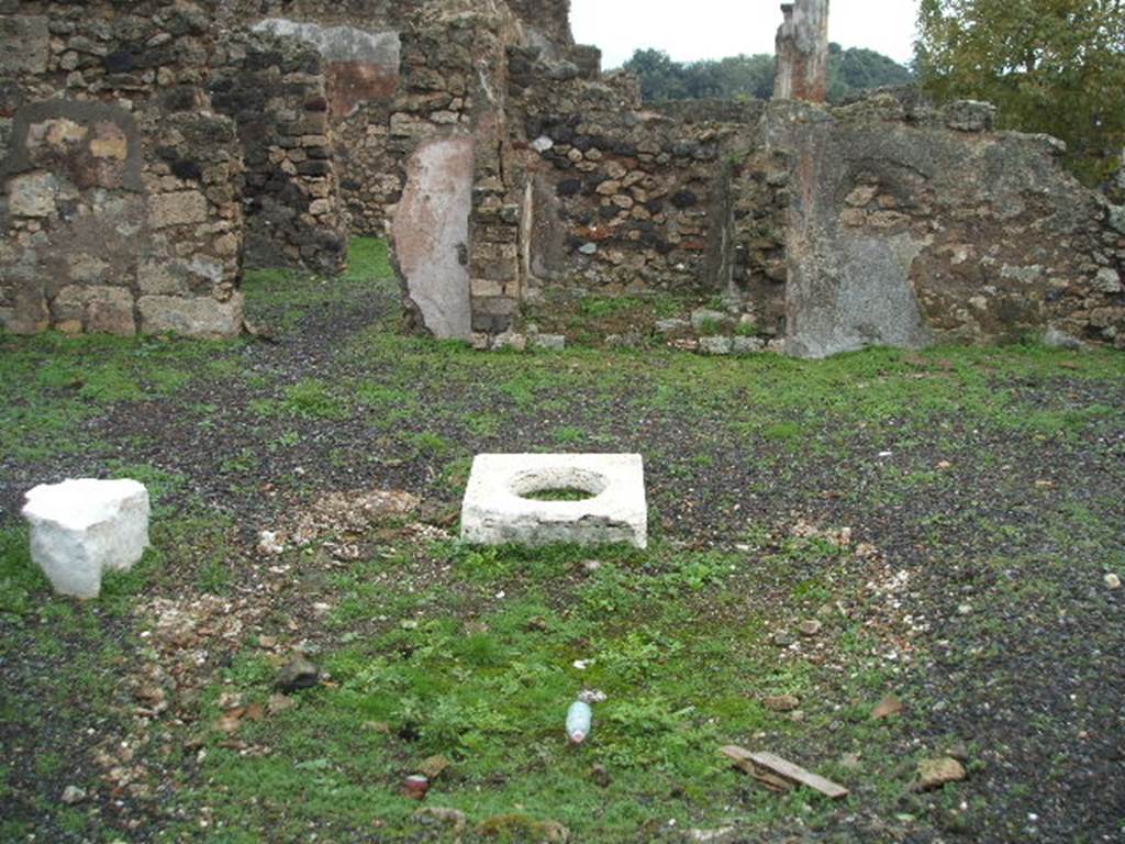 VIII.3.18 Pompeii. December 2004. Looking east across atrium and remains of impluvium, towards site of lararium/cupboard.