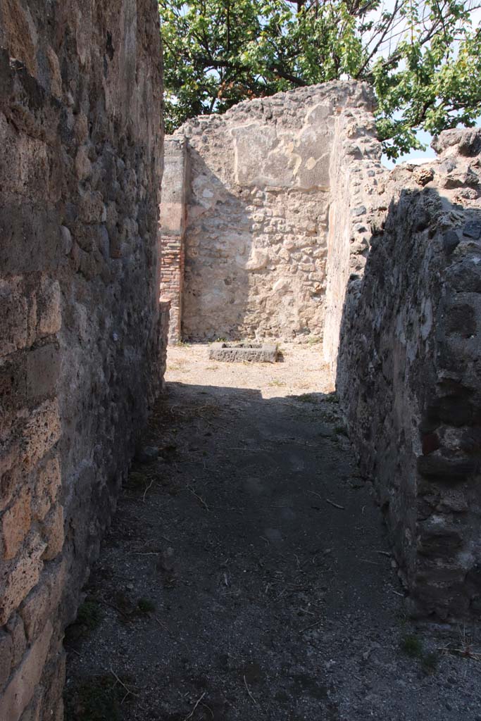 VIII.3.18/16 Pompeii. September 2021. 
Looking north through doorway to corridor on north side of peristyle. Photo courtesy of Klaus Heese.