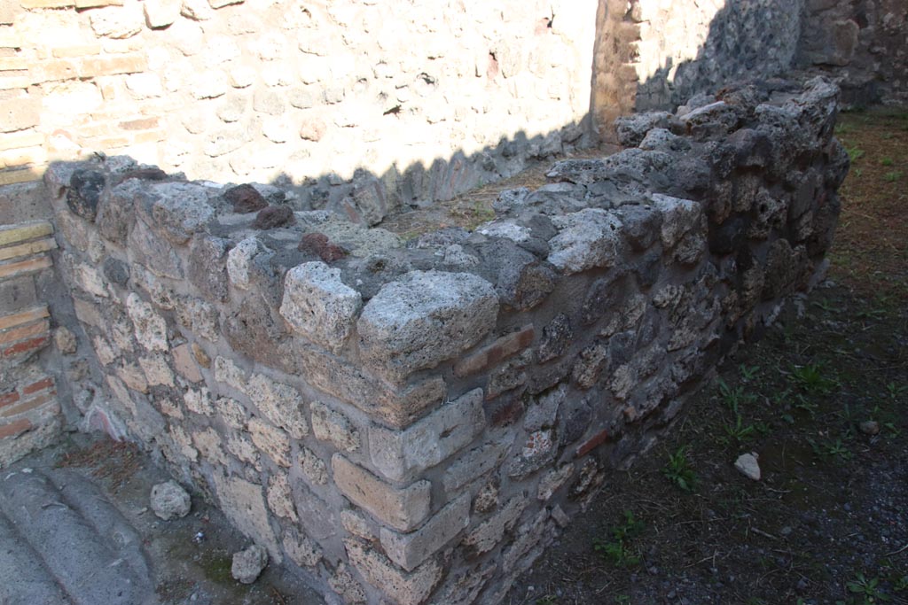 VIII.3.23 Pompeii. October 2022. Looking north-east towards rear of counter and north wall. Photo courtesy of Klaus Heese.