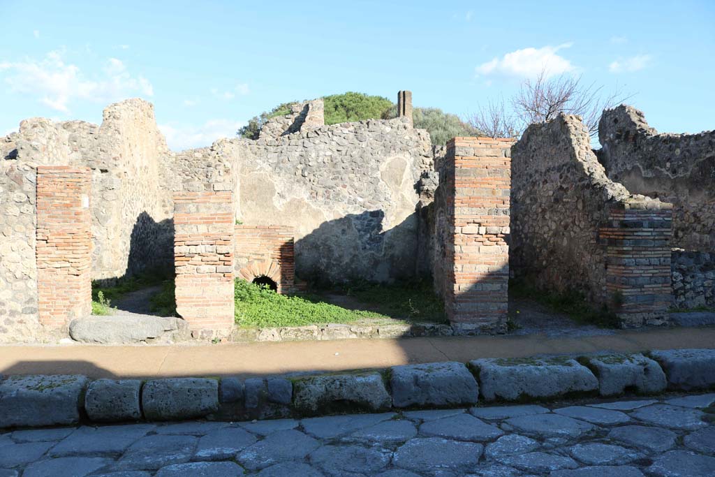 VIII.3.25, Pompeii, in centre. December 2018. 
Looking towards entrance doorways on east side of Via delle Scuole. Photo courtesy of Aude Durand.