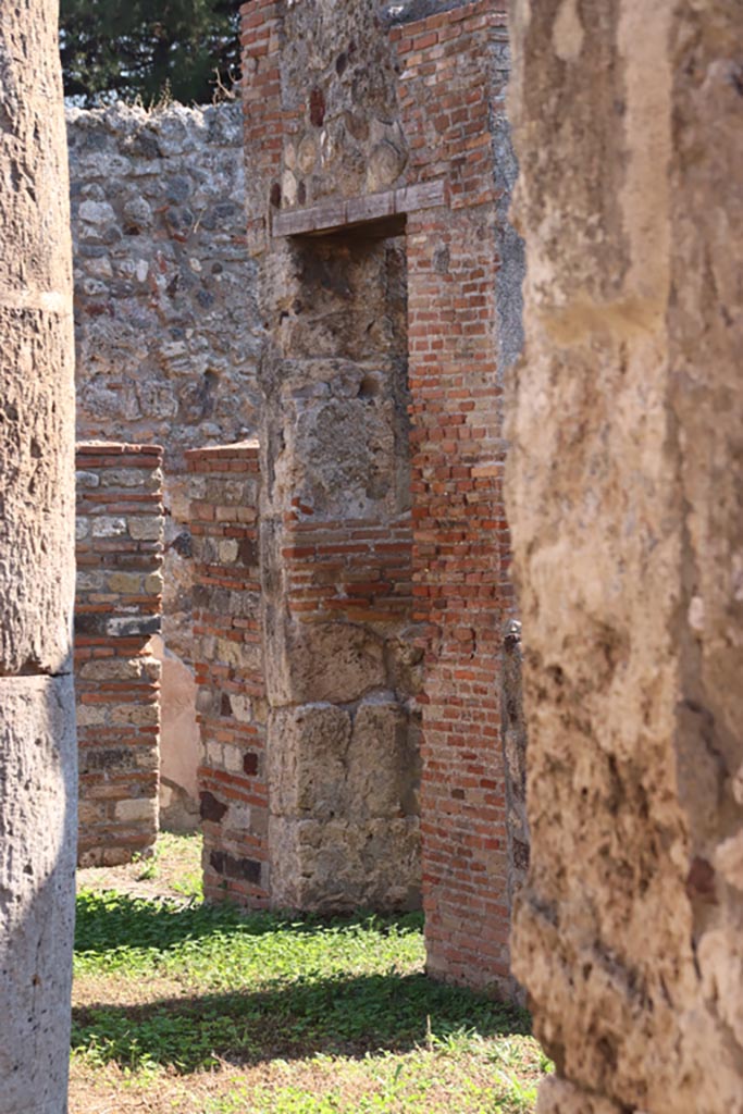 VIII.3.27 Pompeii. October 2022. 
Looking south-east from entrance corridor towards corridor on south side of peristyle, leading to kitchen, etc.
Photo courtesy of Klaus Heese.