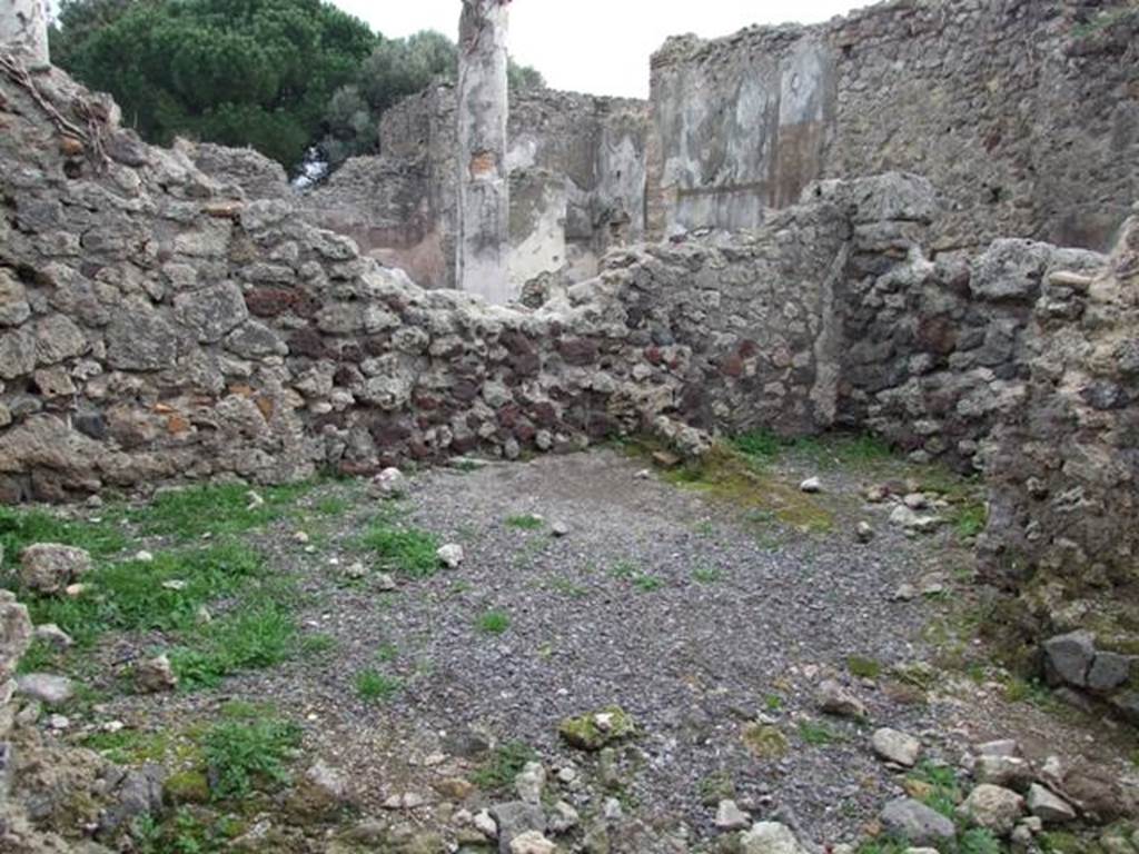 VIII.3.27 Pompeii. December 2007. Looking towards south-east corner of kitchen rooms, with VIII.3.24 in background.
The remains of a room, on the left centre, would have belonged to the east wall of the kitchen rooms.
The south wall of a small room in the kitchen area can be seen, centre right. 
The broken wall, on the right, would appear to lead into a long room on the south side of the kitchen rooms, and seems to be part of VIII.3.24.
