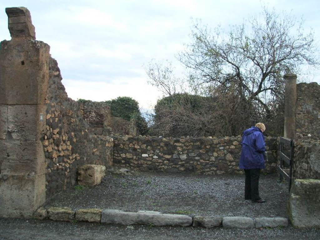 VIII.3.28 Pompeii. December 2004. Looking east to entrance. On the left would have been the stairs to upper floor, on the right was the doorway to the rear room.