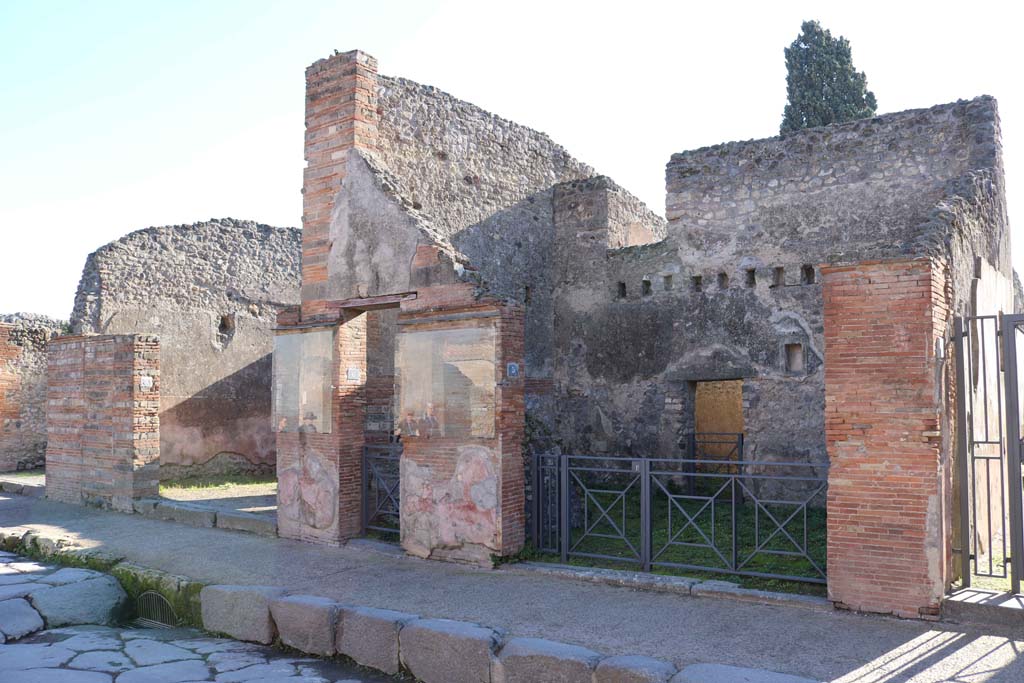 VIII.4.7, VIII.4.6, and VIII.4.5 Pompeii, right of centre. December 2018. 
Looking to entrance doorways on south side of Via dell’Abbondanza. Photo courtesy of Aude Durand.