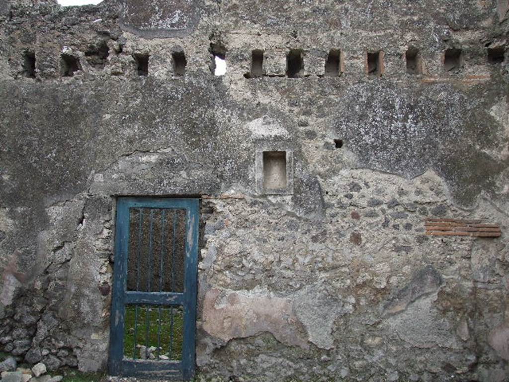 VIII.4.5 Pompeii. December 2006. South wall of shop, with doorway to room joined to VIII.4.4.
