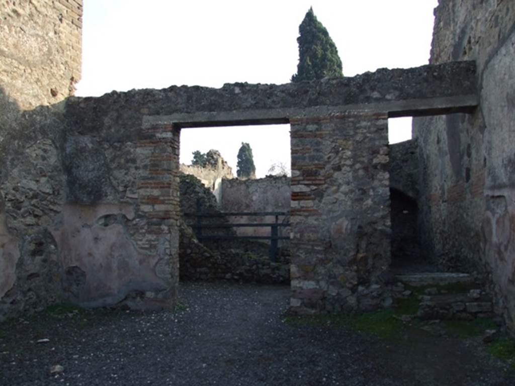 VIII.4.7 Pompeii. December 2007. 
Looking towards south wall and doorway to rear room and two masonry steps that lead to wooden steps for access to upper floor.