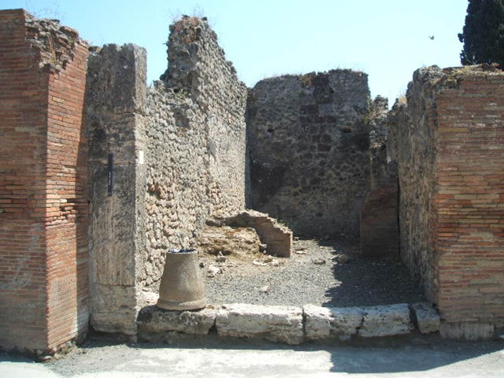 VIII.4.11 Pompeii. May 2005.  Entrance. According to Della Corte this shop and the annexed modest dwelling was held by an unknown Pigmentarius.
Many colouring materials and also of a considerable quantity of bitumen was found. See Della Corte, M., 1965.  Case ed Abitanti di Pompei. Napoli: Fausto Fiorentino. (p.237)