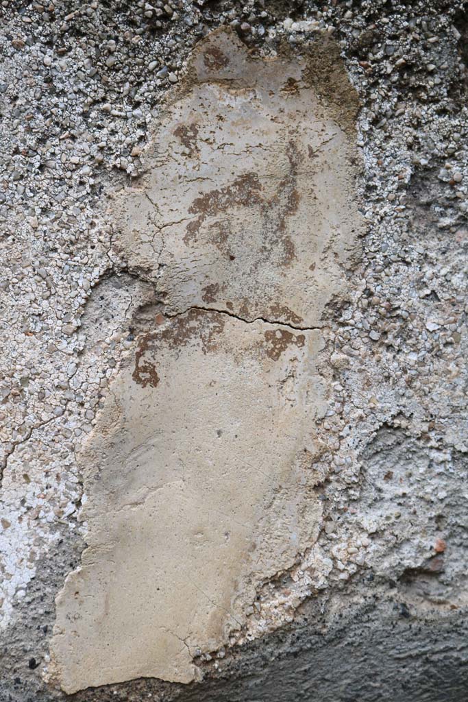 VIII.4.12, Pompeii. December 2018. 
Remaining painted plaster on right side of niche, from the lararium painting ? 
Photo courtesy of Aude Durand.