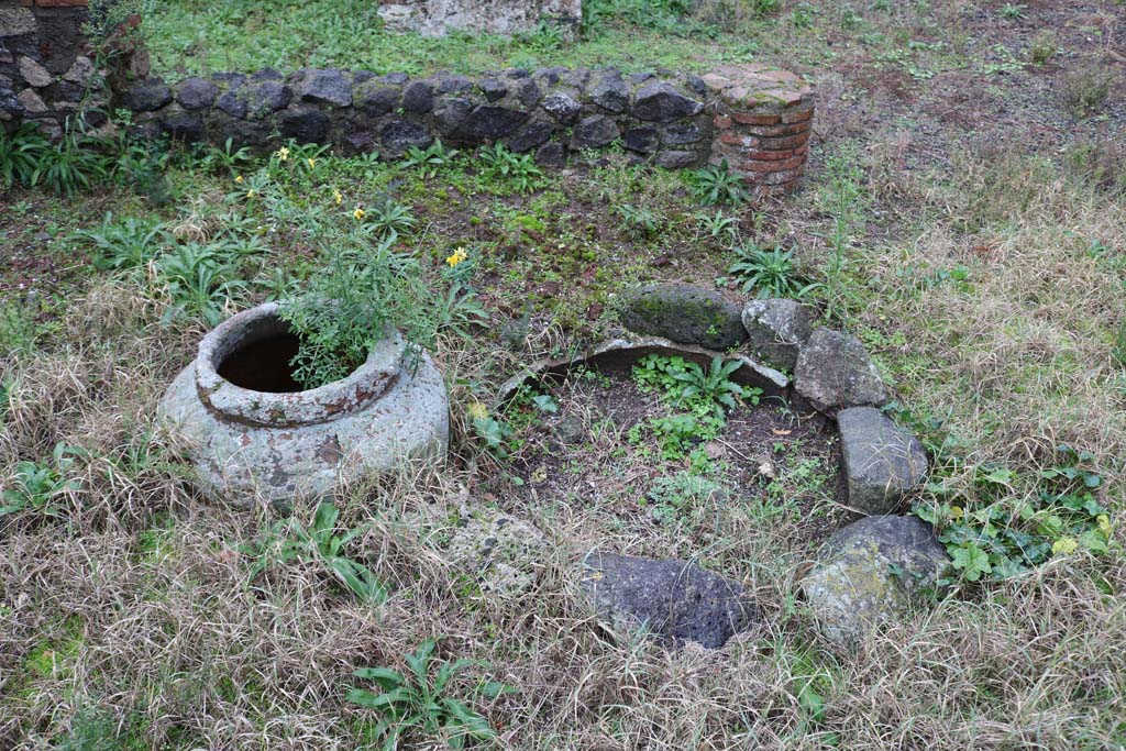 VIII.4.12, Pompeii. December 2018. 
Detail of items near south side of peristyle. Is this the masonry pool, as described by Jashemski. Photo courtesy of Aude Durand.