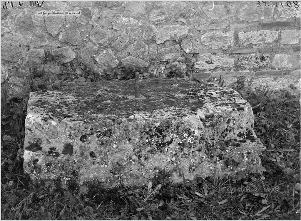 VIII.4.12 Pompeii. 1932. Large stone used as base for an arca, near south wall of peristyle.
According to Pernice –
The base was found on the south side of the peristyle between 2 rooms in front of a late period wall with brick surround.
The base is irregularly notched at the corners. In the middle there is a fastening pin in the lead cast.
See Pernice, E., 1932. Hellenistische Tische, Zisternenmündungen, Beckenuntersätze, Altäre u. Truhen. Berlin, p. 73, Taf. 43.6.
DAIR 32.1108. Photo © Deutsches Archäologisches Institut, Abteilung Rom, Arkiv. 
Thanks to Espen B. Andersson for assisting us in our interest in money-chests.