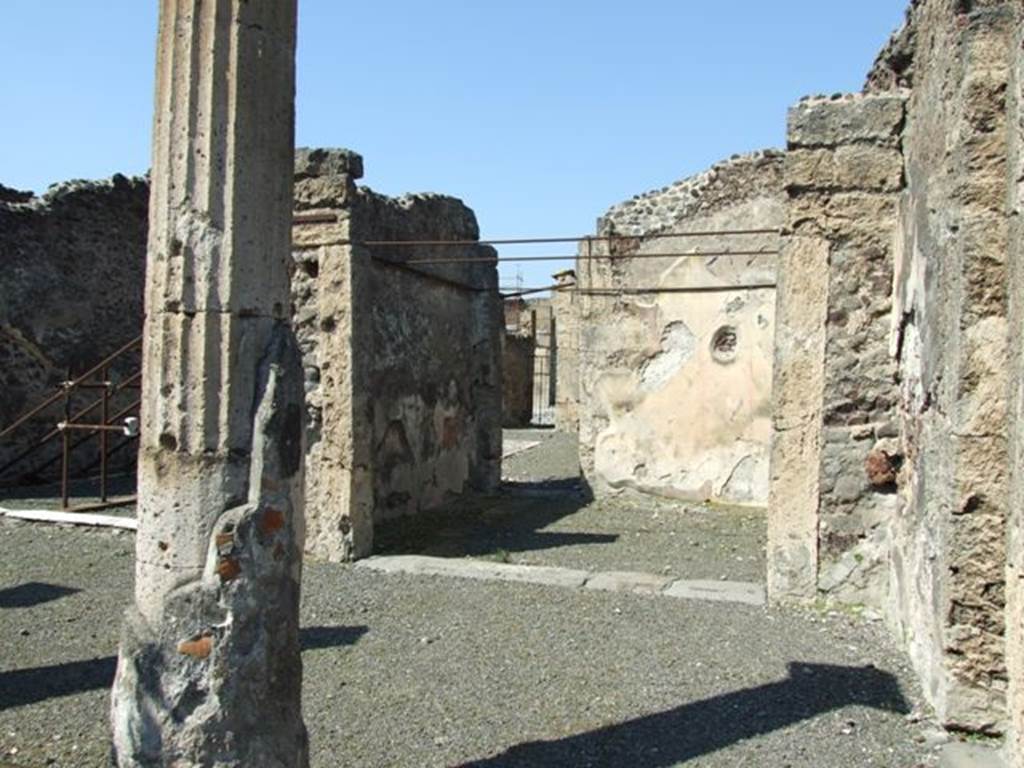 VIII.4.15 Pompeii. March 2009. Room 5, oecus.  Looking north towards the north-east corner of the portico, the oecus, and the small doorway into the atrium. According to Fiorelli, when excavated this oecus had two paintings on its walls.  He thought one was Paris and Oenone. 
The other representing two bearded men talking together and accompanying their words with gestures.  Helbig wrote, this room had paintings of Paris and Oenone (1280) and the other was unclear (1398).
See Helbig, W., 1868. Wandgemälde der vom Vesuv verschütteten Städte Campaniens. Leipzig: Breitkopf und Härtel.
See Pappalardo, U., 2001. La Descrizione di Pompei per Giuseppe Fiorelli (1875). Napoli: Massa Editore. (p.129)