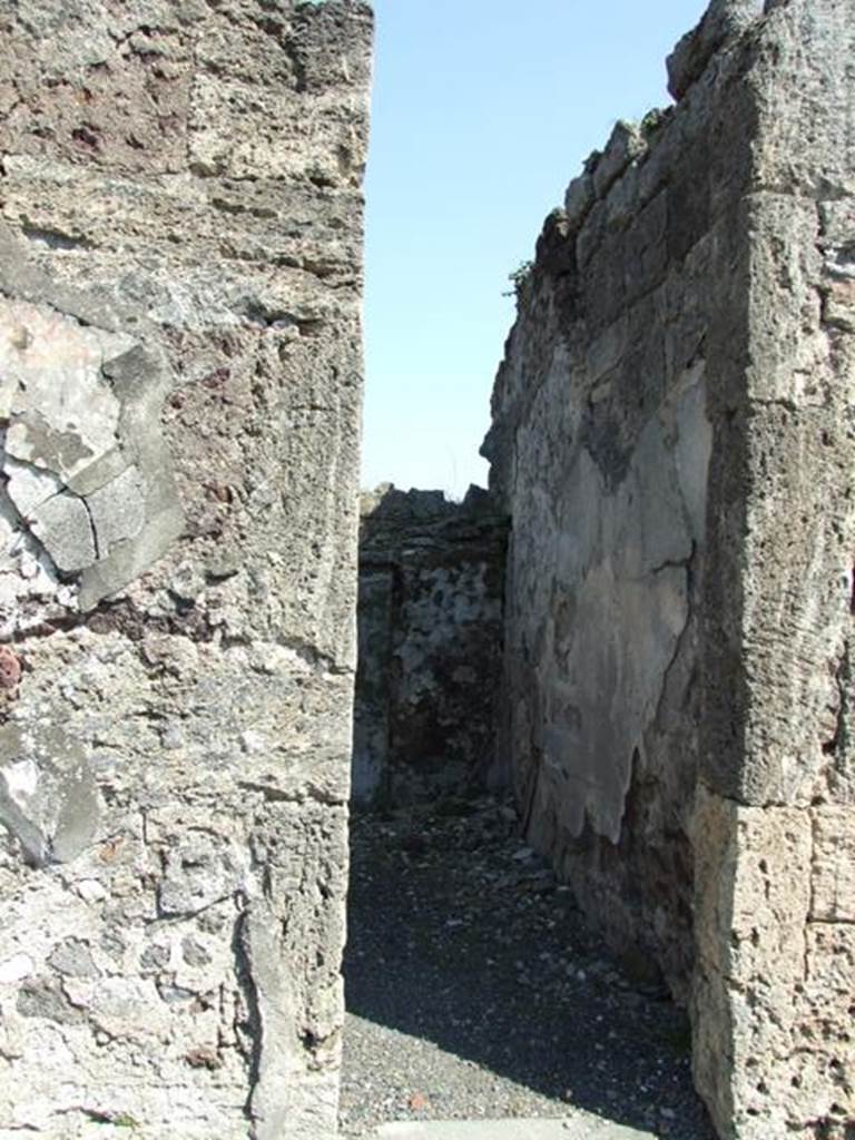 VIII.4.15 Pompeii. March 2009. Doorway to room 12, triclinium, looking east.